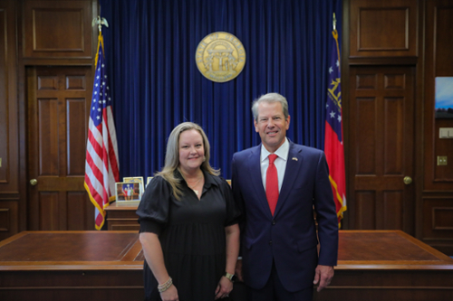 Middle Georgia State University’s Betsy McDaniel poses with Governor Brian Kemp. 